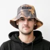 Ann My Dice bucket hat in brown tie-dye, worn by model